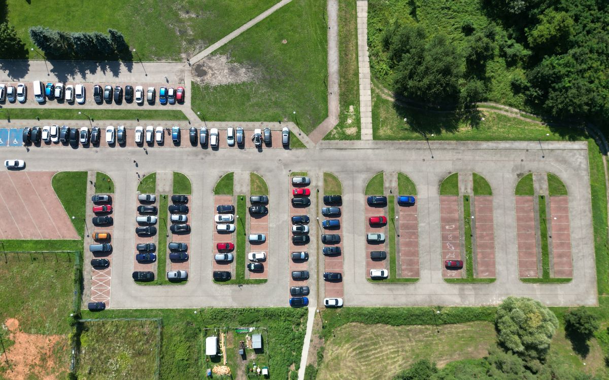 Aerial view of TerminalParkHeathrow long stay car parking compound — secure secure rows of vehicles near Heathrow